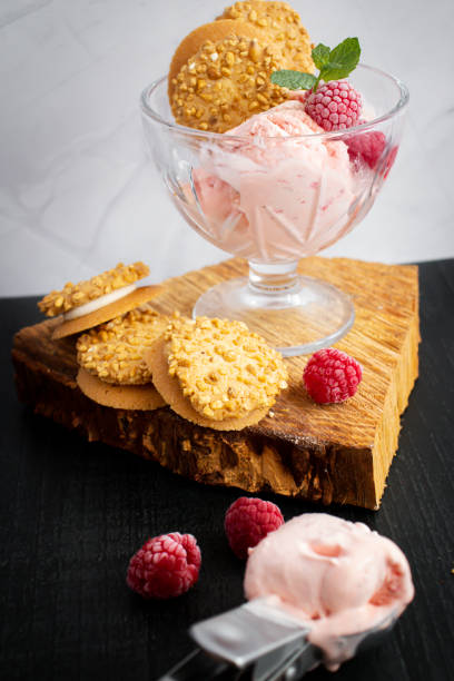 istock Raspberry ice cream in a bowl. on a dark background. Sweet dessert 1511739653