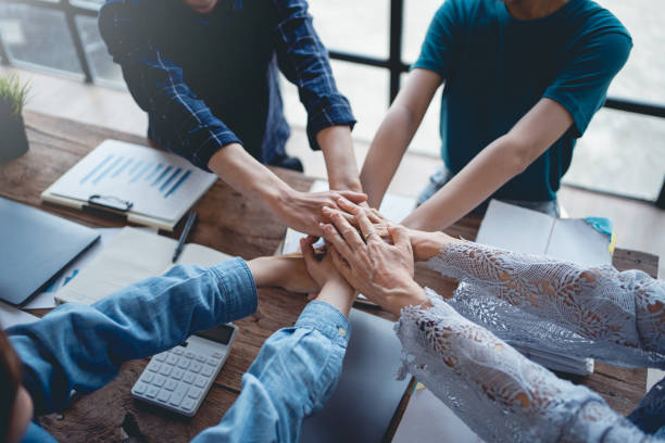 istock Young entrepreneurs work as a team meeting and work together on a new project that emphasizes unity and fist-pumping teamwork as a promise of unity in the workplace. 1511757164