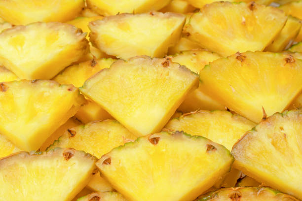 istock Pineapple juicy yellow slices as a background. 1511779491