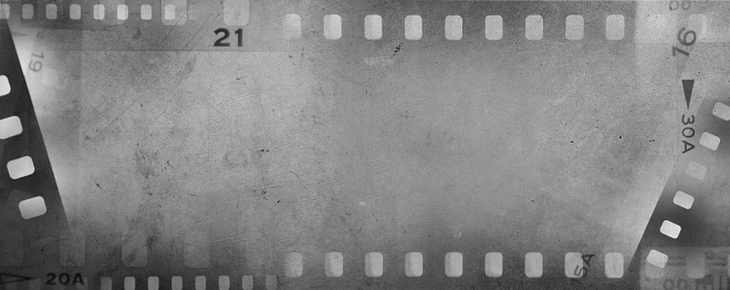 Film negative frames grey background. Copy space