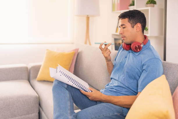 istock Man sending a voice message while working at home 1511811529