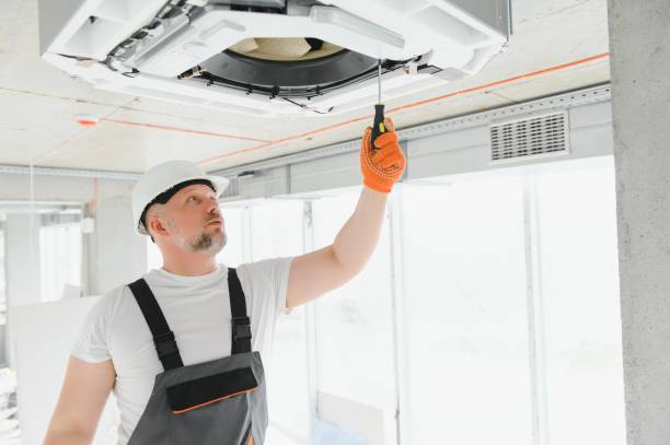 istock Worker repairing ceiling air conditioning unit 1511867472