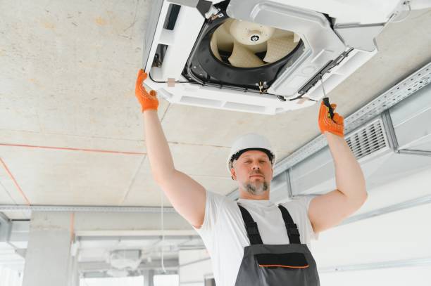 istock Worker repairing ceiling air conditioning unit 1511868585