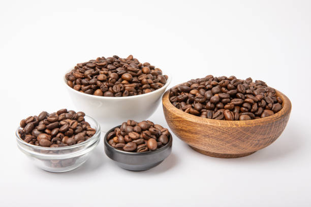 istock Bowls and jars with coffee beans isolated on white background. 1511912208