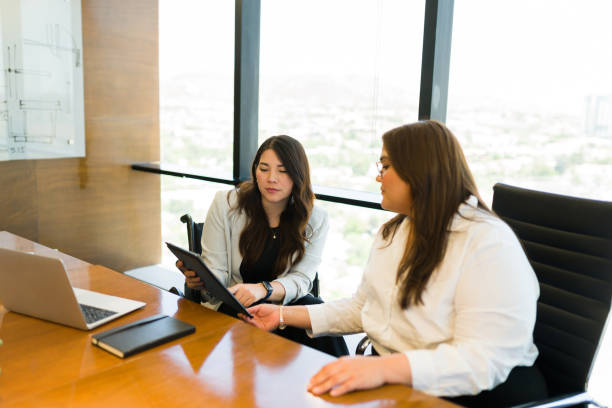 istock Two female professionals working together in office 1511933768
