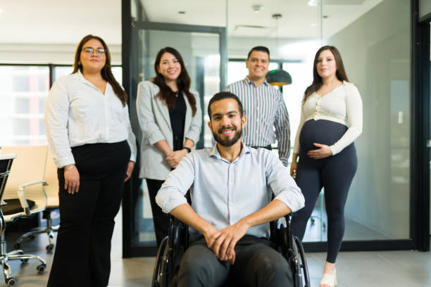 istock Disabled businessman with his colleagues in office 1511934257