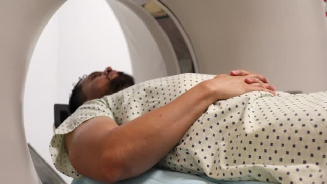Man undergoing a CT scan in a hospital
