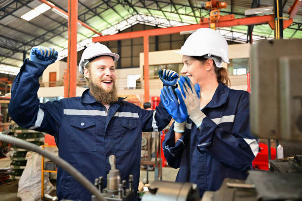 istock Mechanical engineers repairing engine machine at factory 1511943084