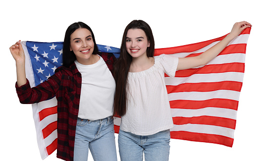 4th of July - Independence day of America. Happy mother and daughter with national flag of United States on white background