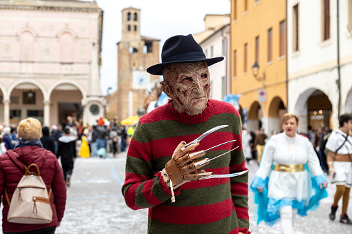 Piove di Sacco, Veneto, Italy - Mar 26th, 2023: Man dressed as the fictional character of horror films Freddy Krueger at a street carnival parade