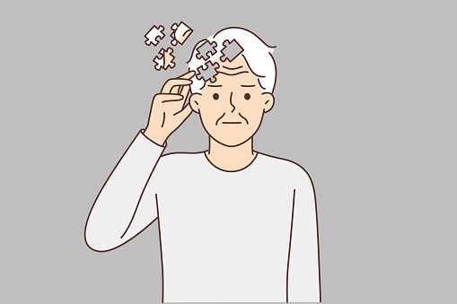 Elderly man with puzzles near head, symbolizing dementia, suffers from memory problems or alzheimer disease. Old man needs help of doctor or drugs to treat dementia caused by advanced age.