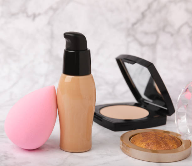 istock Beauty blender and foundation cream on white marble background.Makeup cosmetics sponge. Makeup products. Beauty concept. Place for text. Space for copy. Flat lay 1511965617