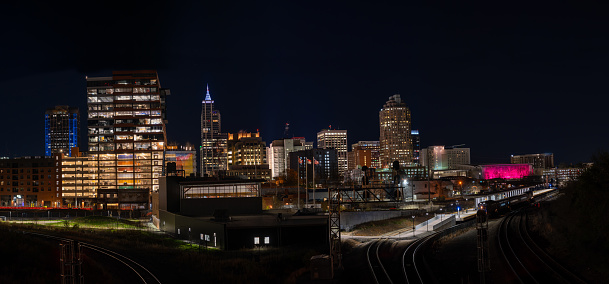Raleigh Skyline At Night with Railroad tracks on both sides