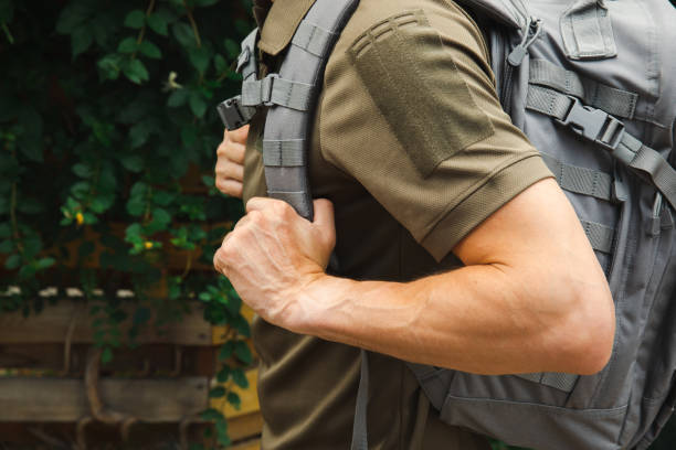 istock Military tactical backpack.Military backpack.Tactical hiking backpack on a military man. Place for text. Copy space. Military concept. No war. 1511998344