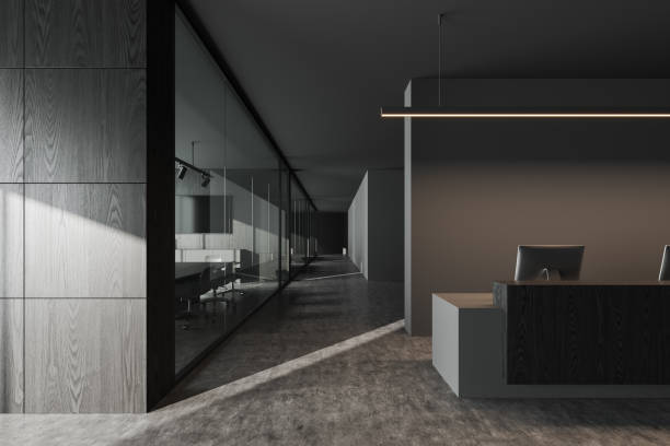 istock Grey reception interior desk with computer and business meeting room 1512006419