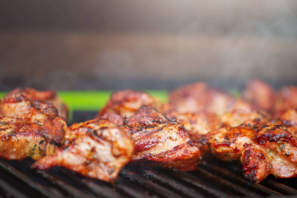 istock Pork meat is grilled. Cooking kebabs on the grill. 1512009992