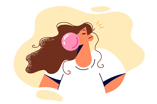 Girl teenager blows chewing gum bubble enjoying fruity pink cud. Young woman with long hair dressed in white casual t-shirt chews chewing gum for concept of laziness and lack of urgent matters