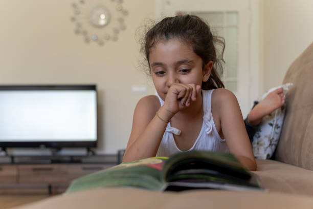 istock Girl reading a book. 1512029673