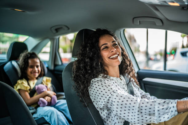 istock Mother and daughter talking at car 1512042459
