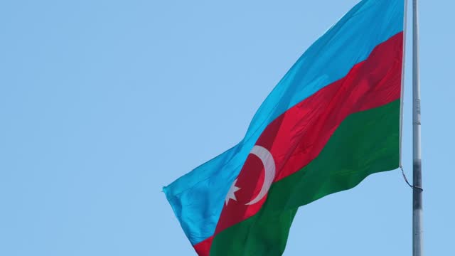 Azerbaijan Flag Waving in Slow-Motion Against a Blue Sky