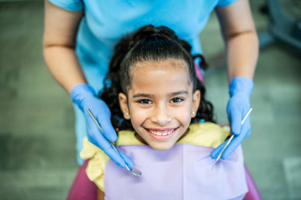 Portrait of girl at the dentist's office Portrait of girl at the dentist's office pediatric dentistry stock pictures, royalty-free photos & images