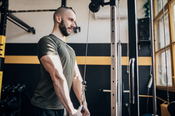 istock Man exercising in gym 1512079079
