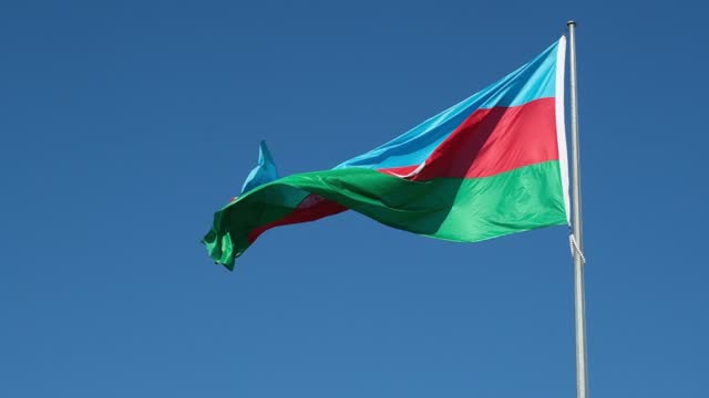 Azerbaijan Flag Waving in Slow-Motion Against a Blue Sky