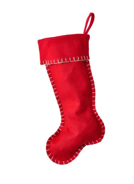 Red Christmas stocking with white stitching isolated cutout on white background