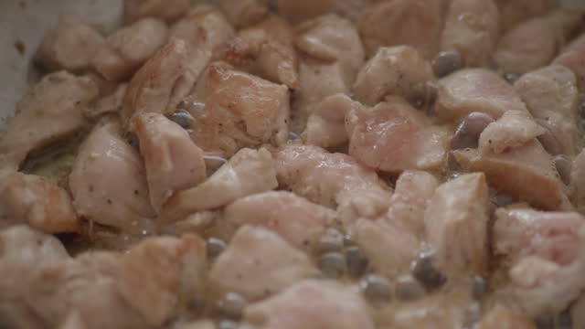 cooking diced chicken breast on frying pan