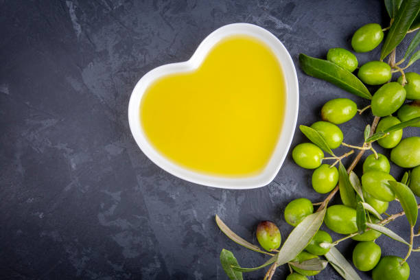 istock Green olive and olive oil isolated 1512203410