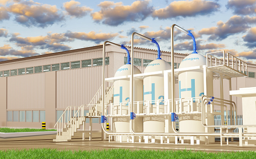 Modern hydrogen power plant. Supplying factory with hydrogen. Factory exterior for production of H2 gas. Innovative energy system. Tankers with H2 logo. Green hydrogen technology. 3d rendering.