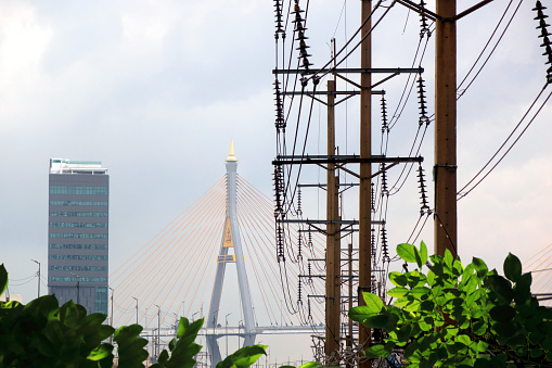 Cityscape view of Bangkok with Bhumibol Bridge 1 and power lines