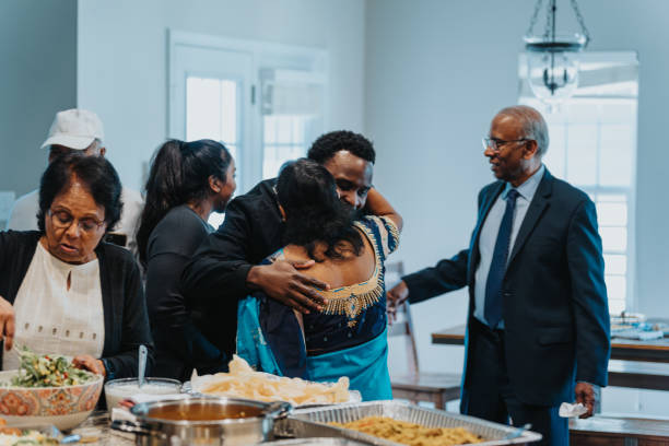 istock Young man greets an elder woman with a hug 1512375917