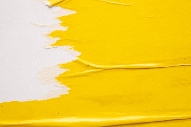 istock Old grunge ripped torn yellow paper poster surface texture background 1512394039