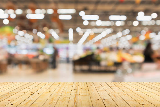 istock Empty wood table top with supermarket blurred background for product display 1512394565