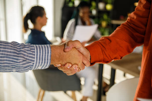 istock Two unrecognizable businessmen sharing hands after a successful meeting 1512395357