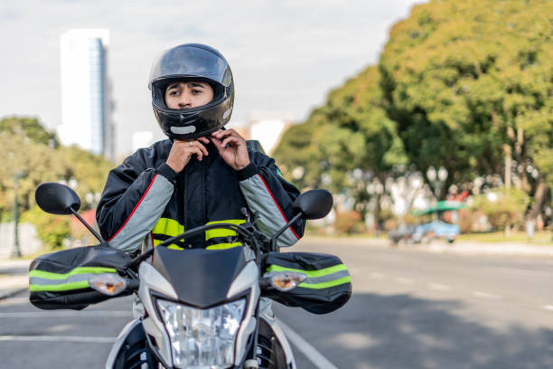 istock Delivery man removing helmet. 1512442786