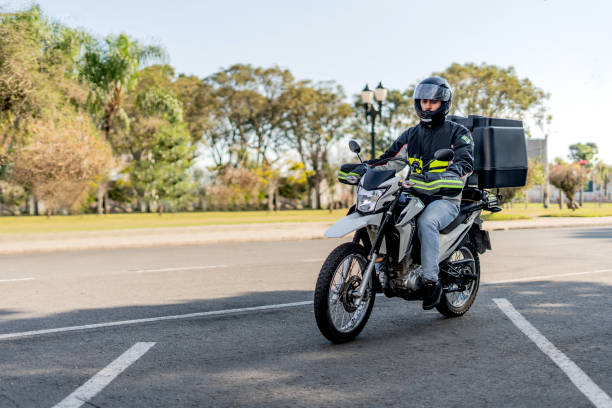istock Delivery man arriving at destination, motoboy 1512443291