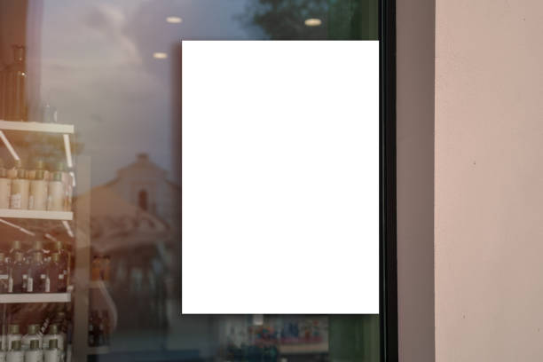White vertical banner fixed on pharmacy window glass outside