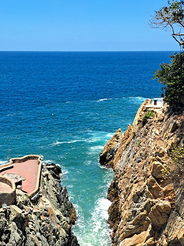 La Quebrada is a cliff with a channel in the port of Acapulco, Guerrero, Mexico where the famous diving is done by young people who climb it
