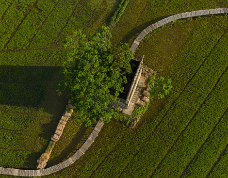 Abstract aerial view of abandoned old brick kiln in the middle of a vast field in Quang Nam
