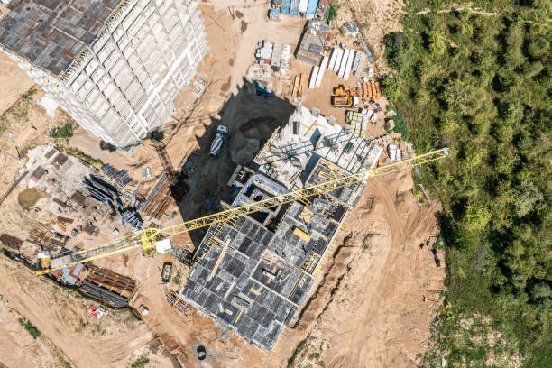 istock construction site. tower crane and construction machinery. housing development. aerial top view from drone. 1512871480
