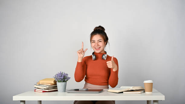 istock An adorable college student presenting her idea with white isolated background. 1512884724