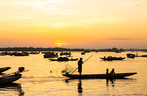 Floating market on Tam Giang lagoon under the sunrise, Thua Thien Hue province