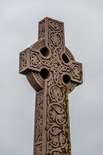 Celtic cross in a graveyard in Ireland