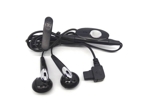 istock Black wired earphones or earbuds isolated on white background. 1512958830
