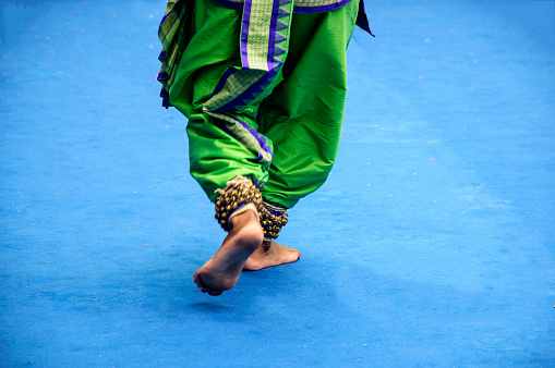 Kolkata,west Bengal. The close up picture of an Indian classical dancer's feet performed in the city street in the eve of Ratha Jatra festival.
