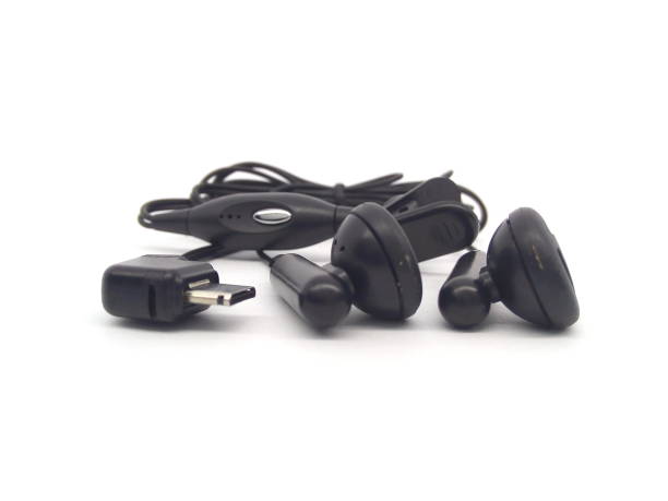 istock Black wired earphones or earbuds isolated on white background. 1512989591