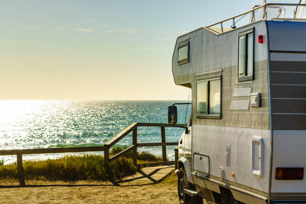 istock Camper rv camping on sea shore, Spain 1512992176