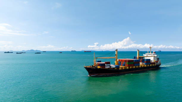 istock cargo logistics container ship sailing in green sea to import export goods and distributing products to dealer and consumers across worldwide, by container ship Transport business service 1513020554